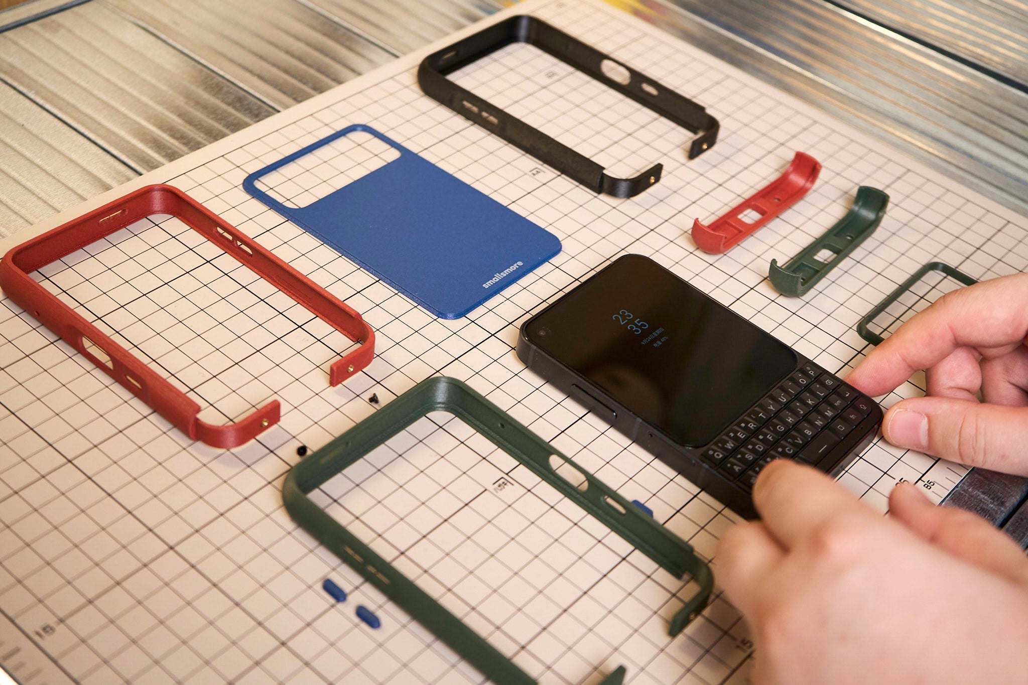 MCase for Titan 2 Elite components arranged around a phone